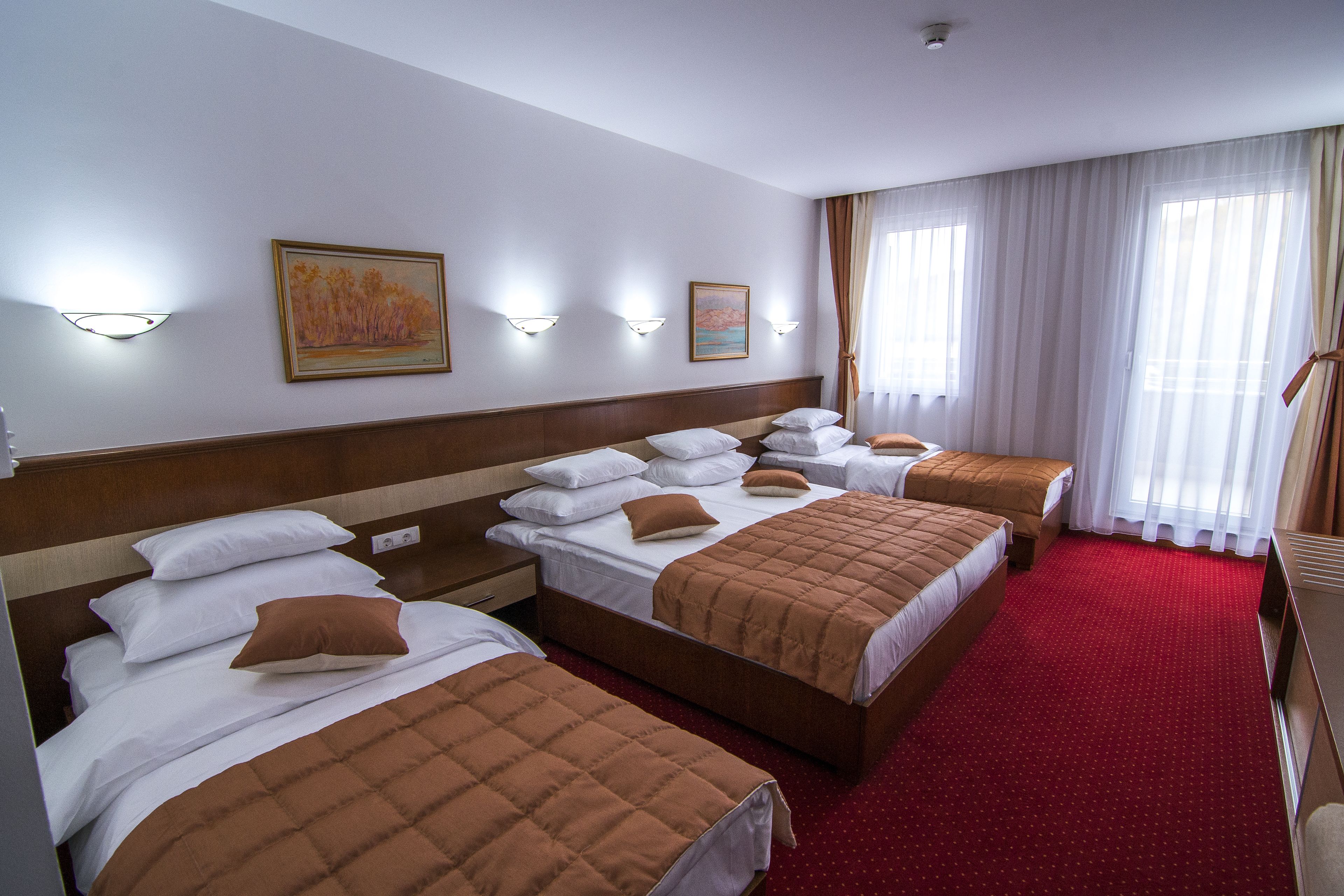 Quadruple Room | Free minibar, in-room safe, desk, soundproofing