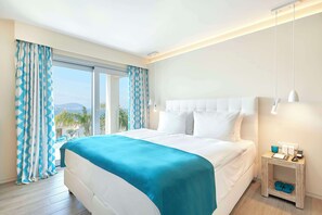 Hypo-allergenic bedding, down comforters, minibar, in-room safe