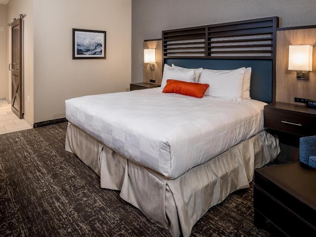 Pillowtop beds, desk, blackout drapes, iron/ironing board