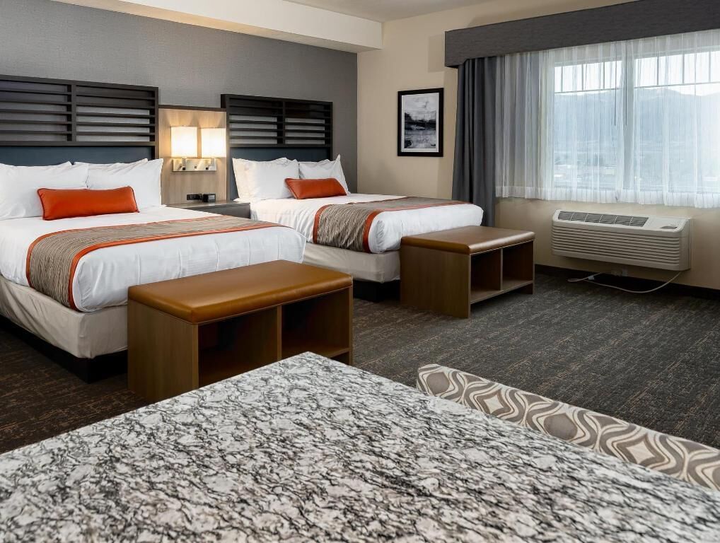 Pillowtop beds, desk, blackout drapes, iron/ironing board
