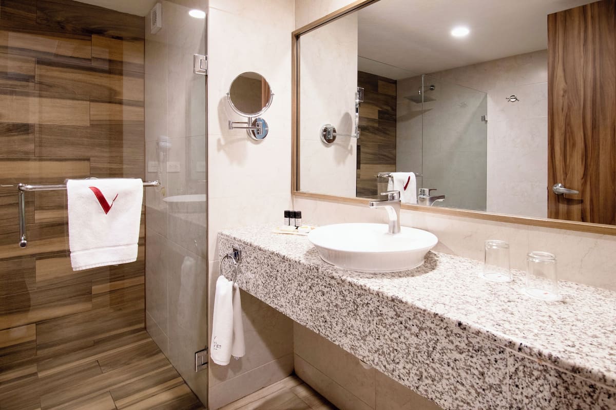 double room, 2 queen beds | bathroom | shower, free toiletries, hair dryer, towels