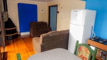 Exclusive House, 2 Bedrooms | Living room | Flat-screen TV, fireplace