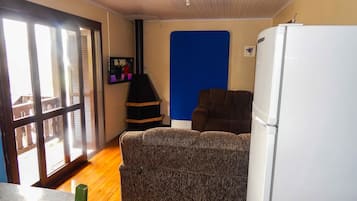 Exclusive House, 2 Bedrooms | Living room | Flat-screen TV, fireplace