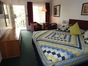 Basic Room, 1 King Bed, Refrigerator (Upstairs or Ground Level) | Individually decorated, blackout drapes, iron/ironing board, free WiFi - The Trails Inn (Eureka Springs)