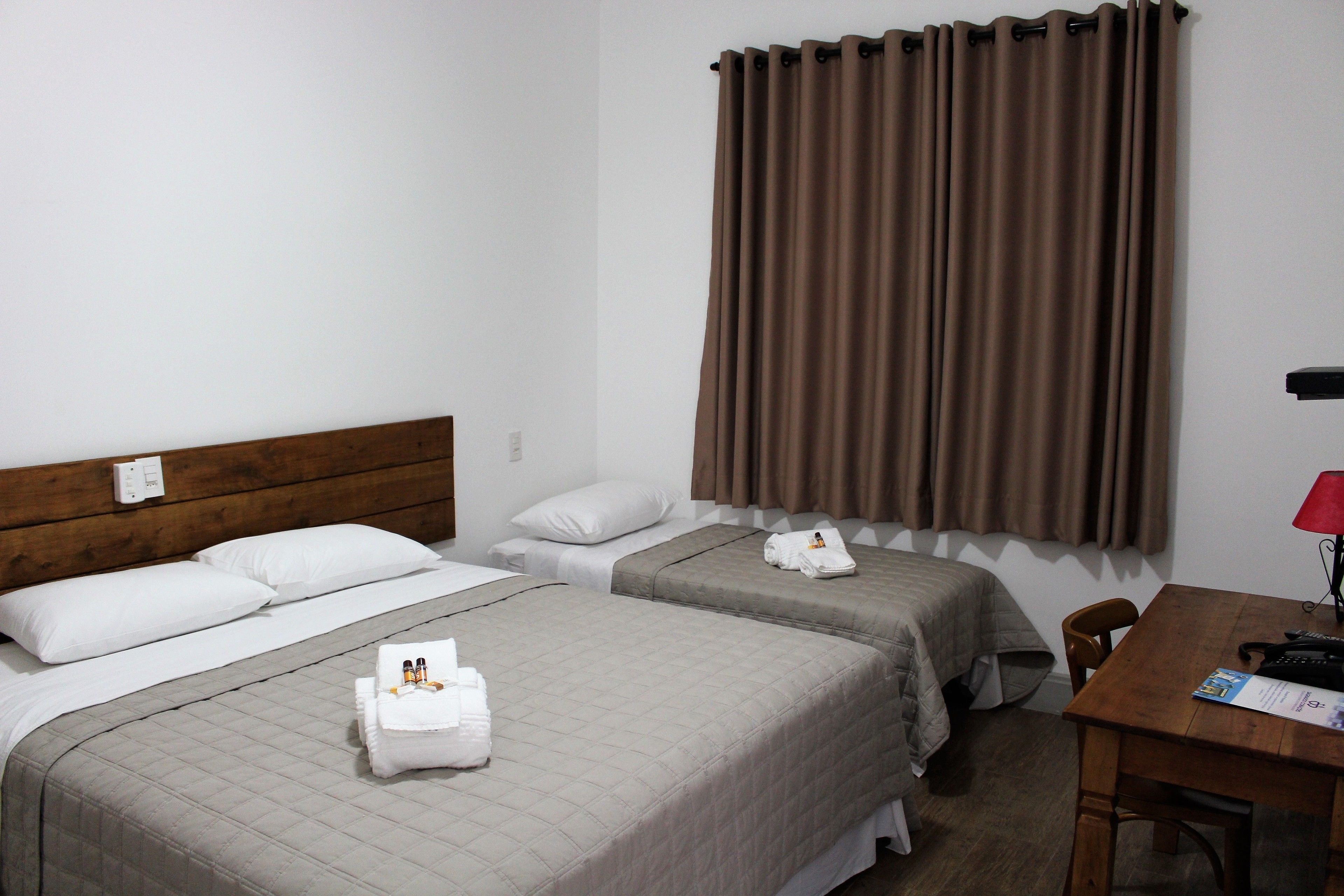 standard triple room | minibar, in-room safe, desk, blackout curtains