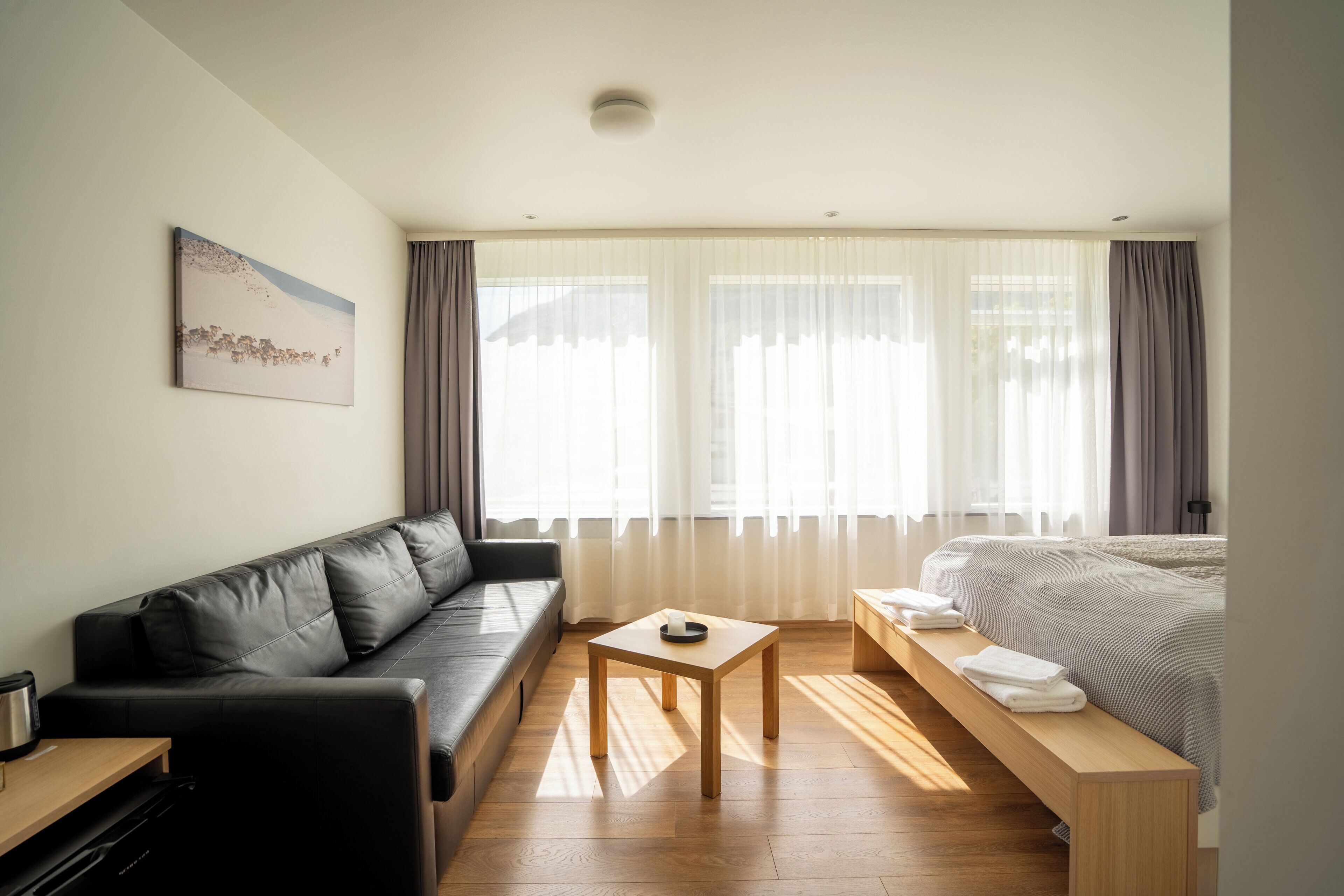 family room | 1 bedroom, blackout curtains, soundproofing, iron/ironing board