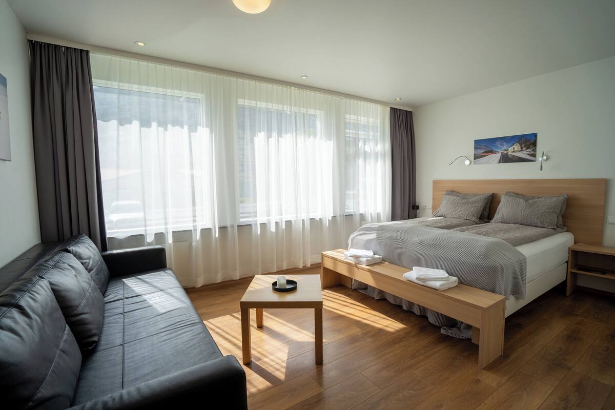 family room | 1 bedroom, blackout curtains, soundproofing, iron/ironing board