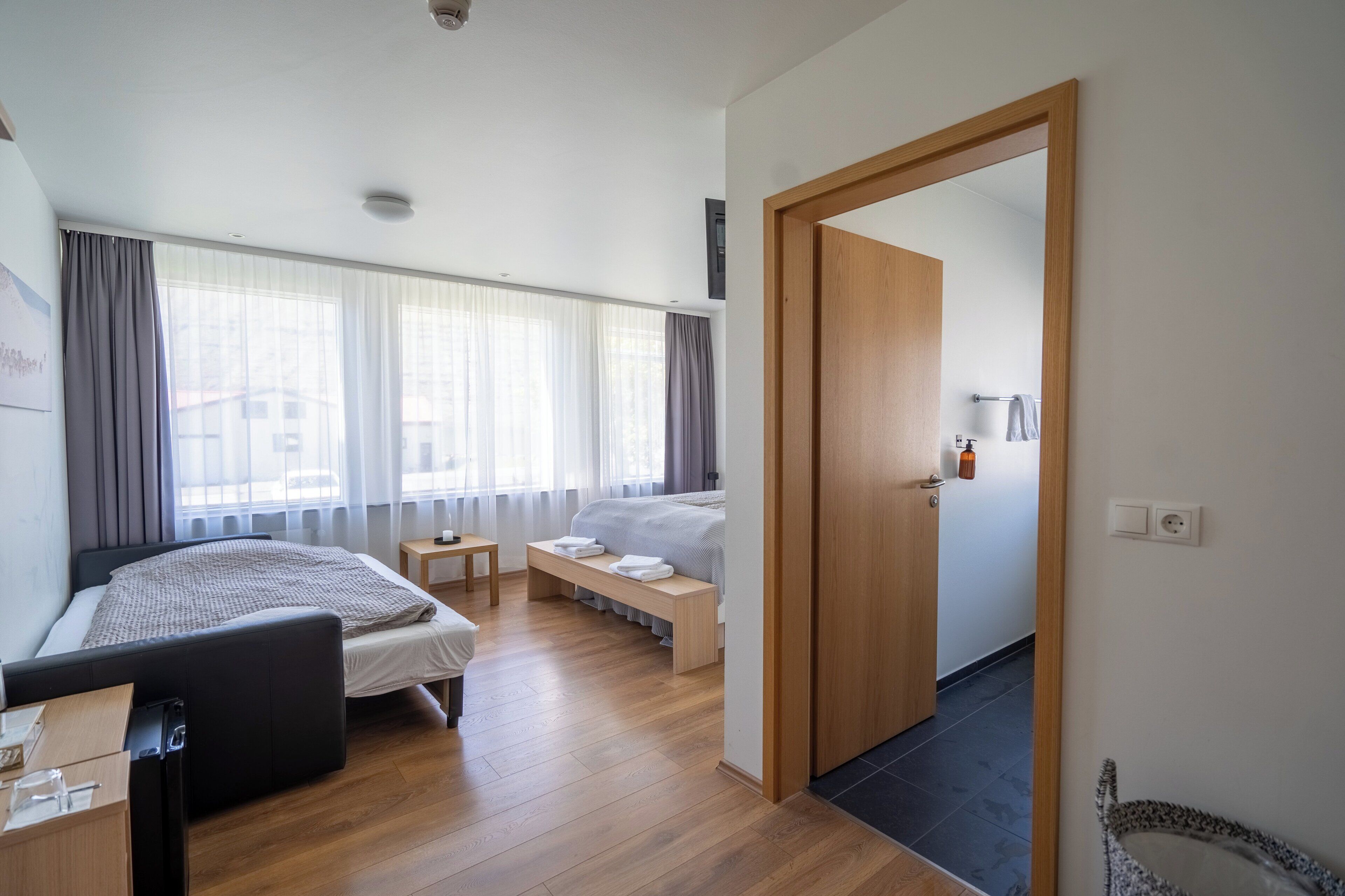 family room | 1 bedroom, blackout curtains, soundproofing, iron/ironing board