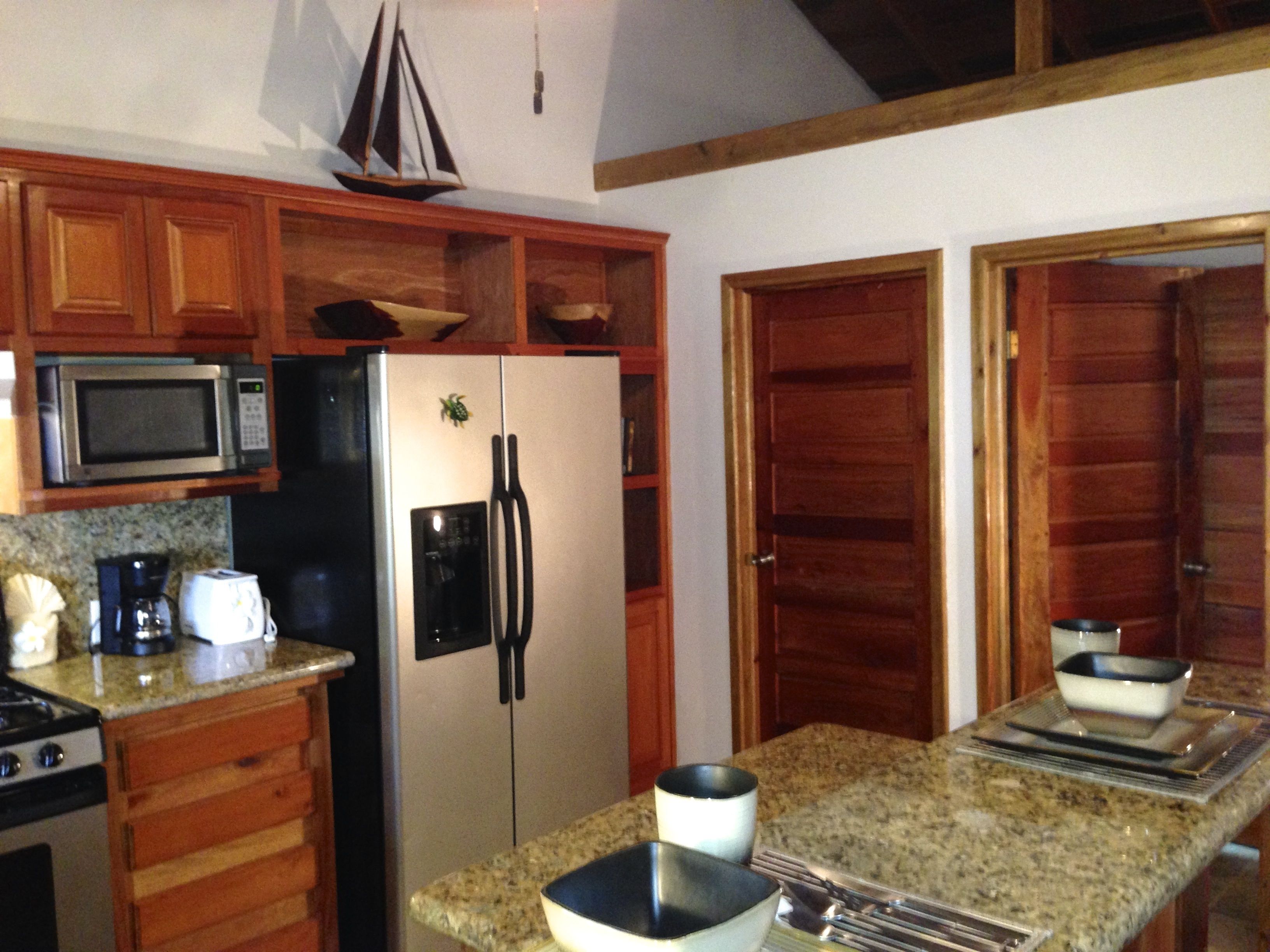 Traditional Cottage, 1 Queen Bed, Kitchen, Beachfront | Private kitchen | Fridge, microwave, oven, stovetop