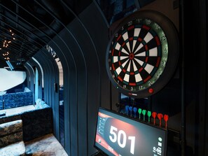 A dartboard with a score of 501, a digital scoreboard, and a staircase leading to a balcony. - Syoenso Hozugawatei (Kameoka)