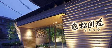 A modern building entrance with a sign that reads "Zhongguancun".