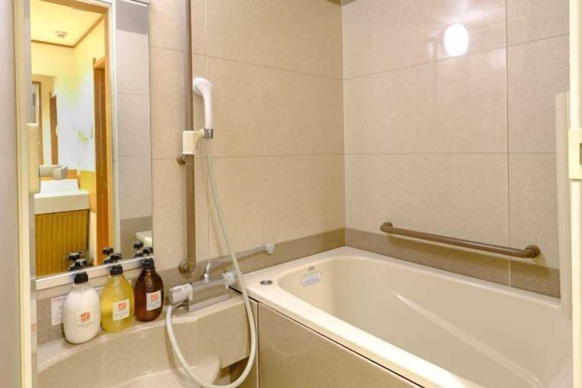Bathroom | Free toiletries, hair dryer, slippers, bidet