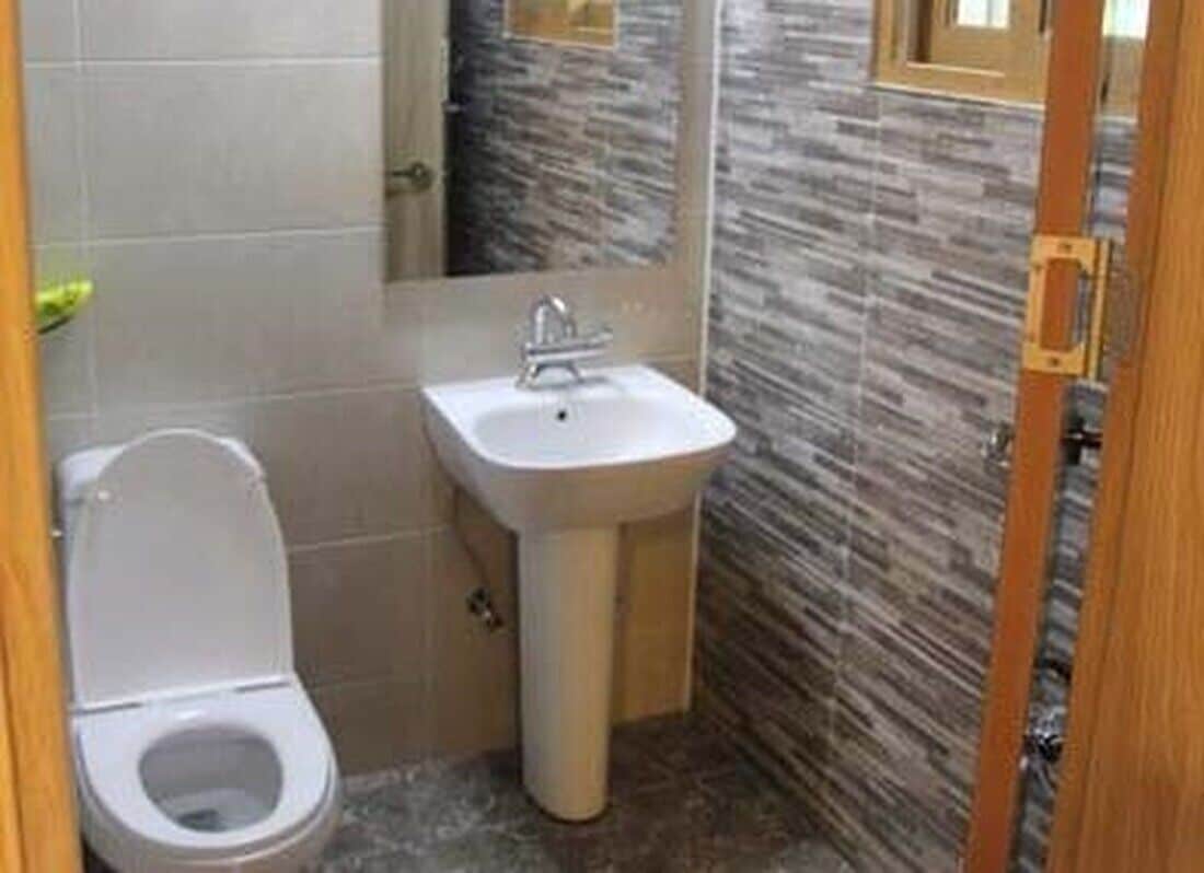 A small bathroom with a toilet and a sink.