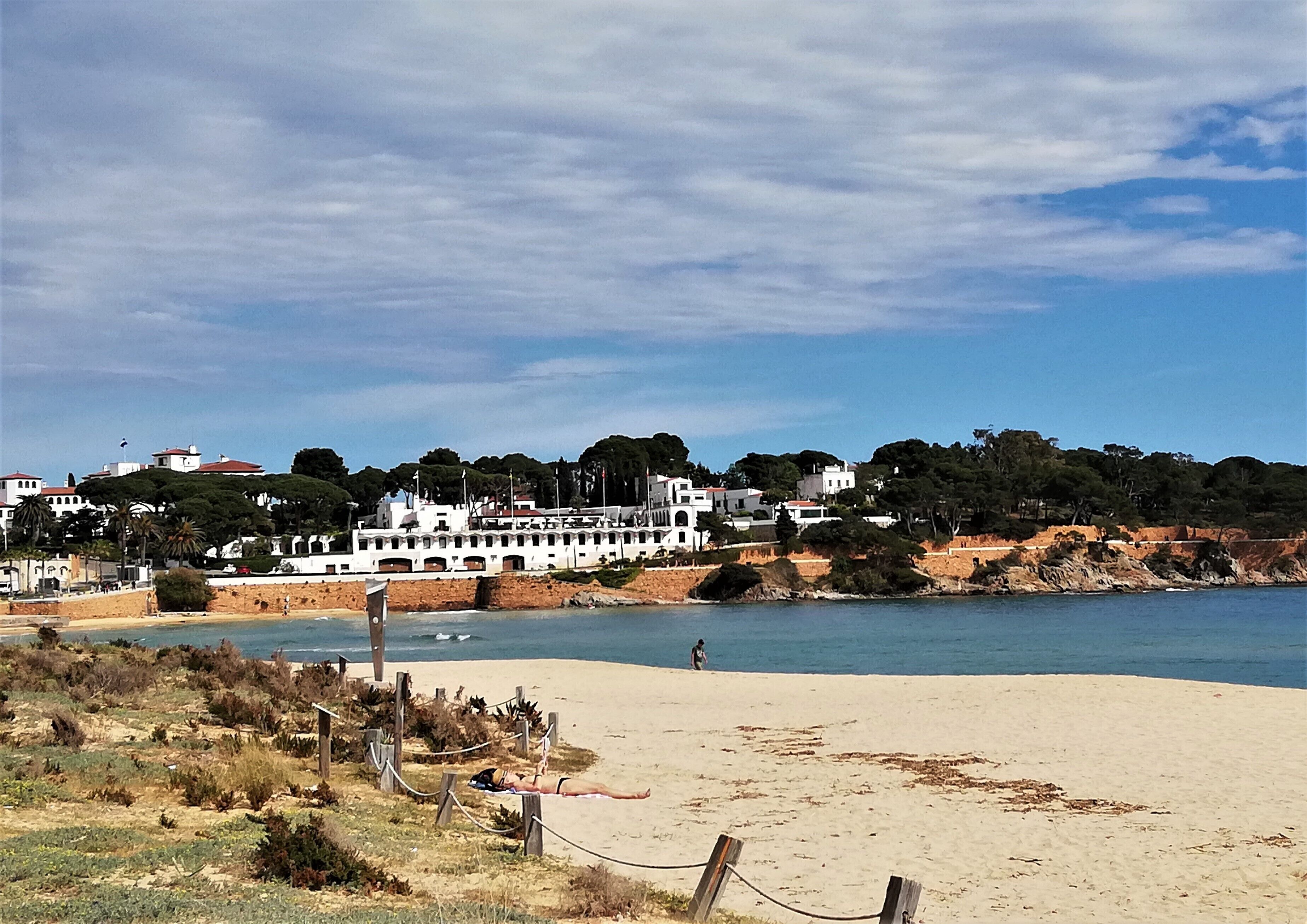 On the beach, sun-loungers