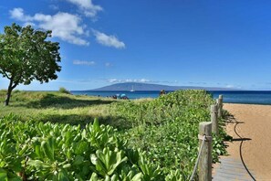 On the beach, sun loungers, beach towels