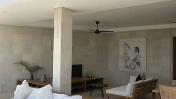 Villa Sempurna - One bedroom villa with pool and ocean views | Living area | Flat-screen TV, DVD player