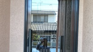 A door with a sign above it. - Guesthouse Kyozen (Kyoto)