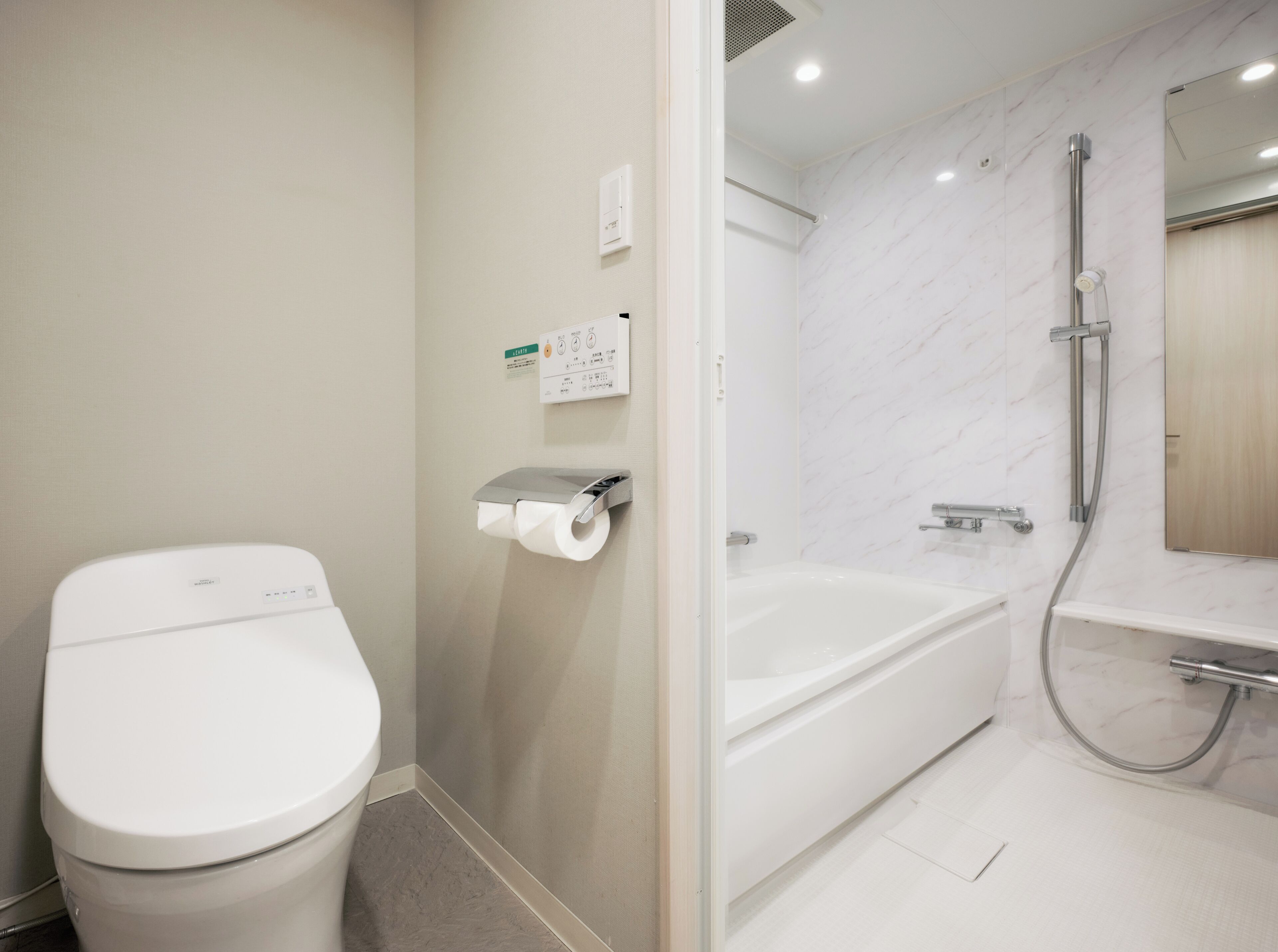 corner twin room | bathroom | separate bathtub and shower, free toiletries, hair dryer, slippers