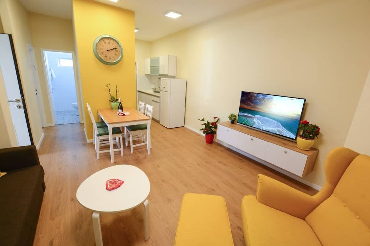 Family Apartment, 1 Bedroom, Balcony | Living area | LED TV