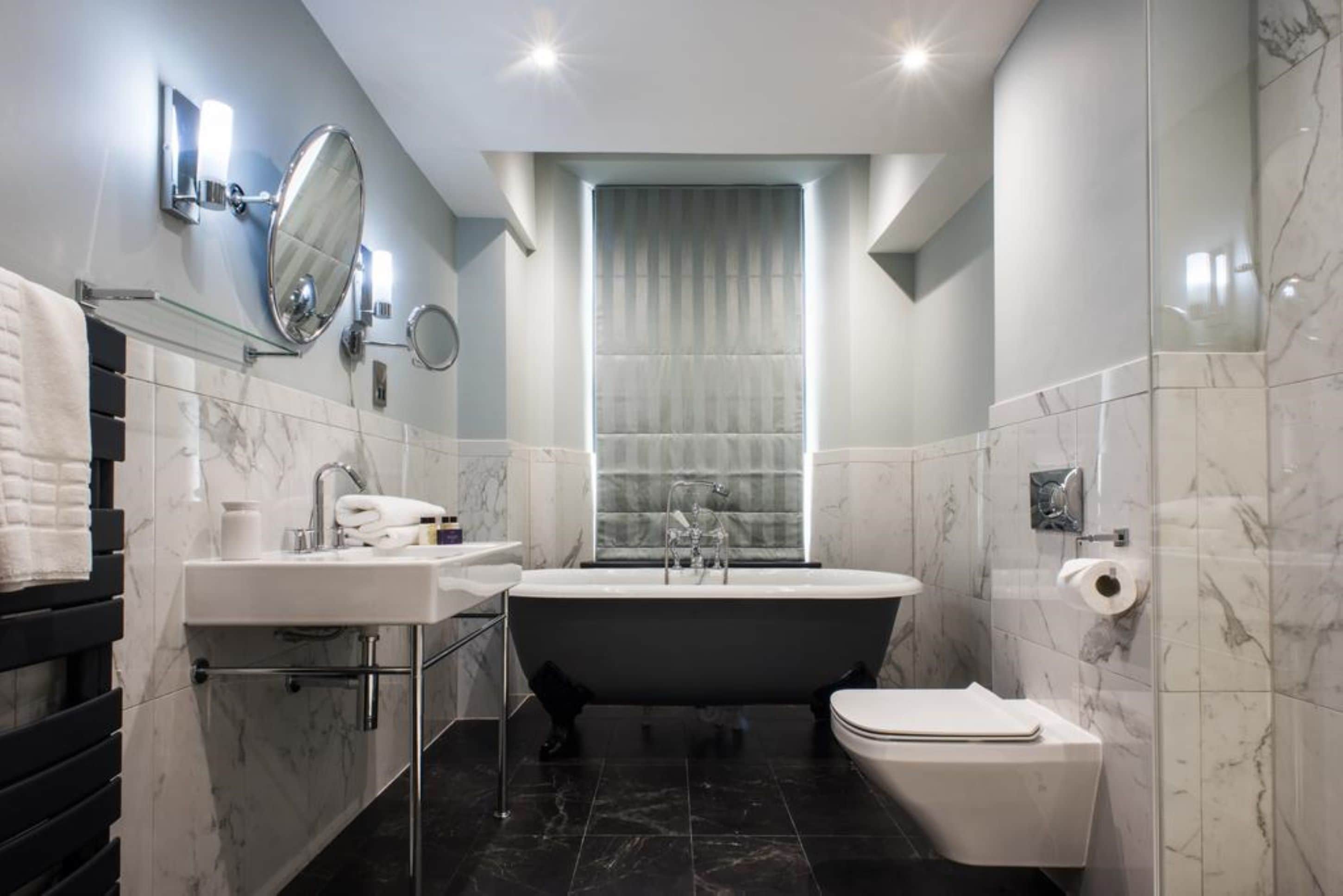 standard studio, 1 king bed | bathroom | shower, designer toiletries, slippers, towels