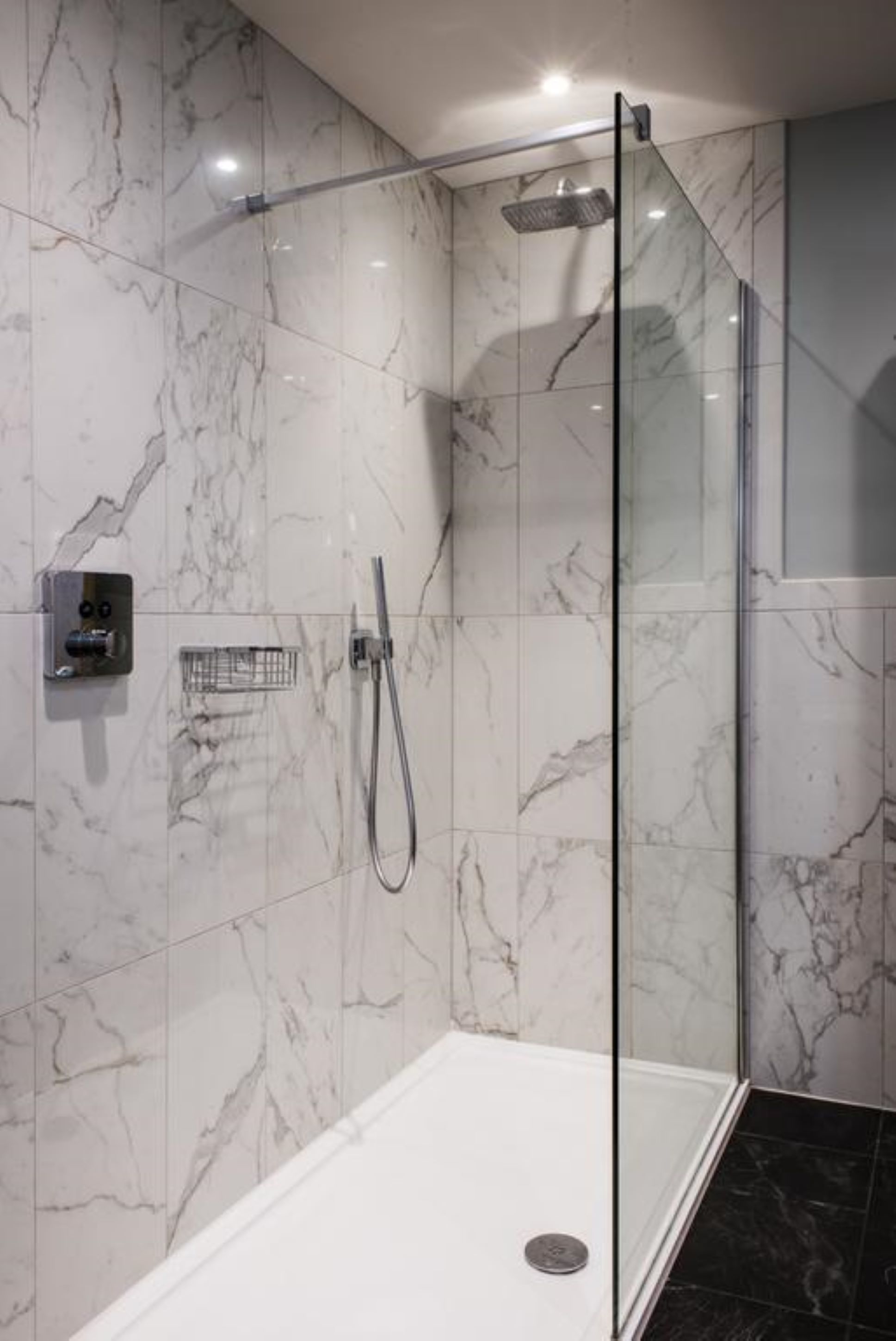 shower, designer toiletries, slippers, towels