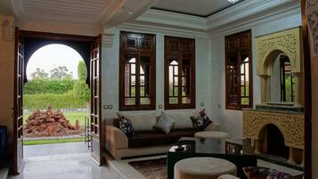 Villa | Living room | 32-inch flat-screen TV with satellite channels, TV, DVD player