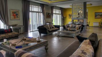 Villa | Living room | 32-inch flat-screen TV with satellite channels, TV, fireplace
