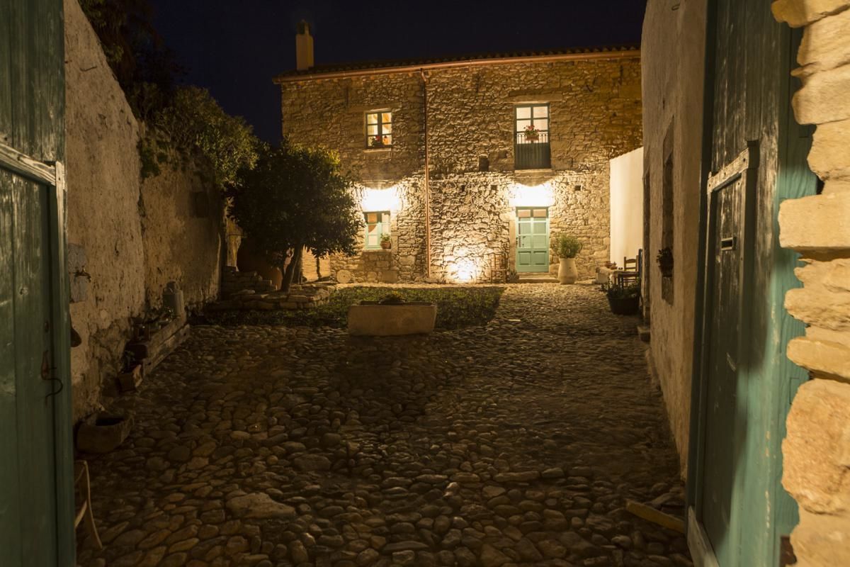 A stone building with a courtyard at night.