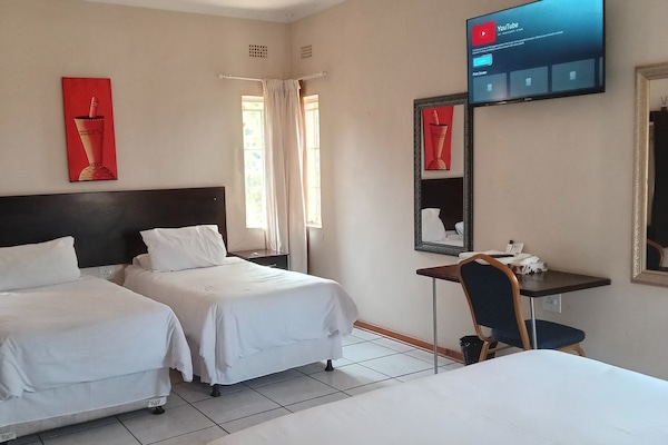 Basic Quadruple Room, Garden View | Desk, laptop workspace, iron/ironing board, free WiFi