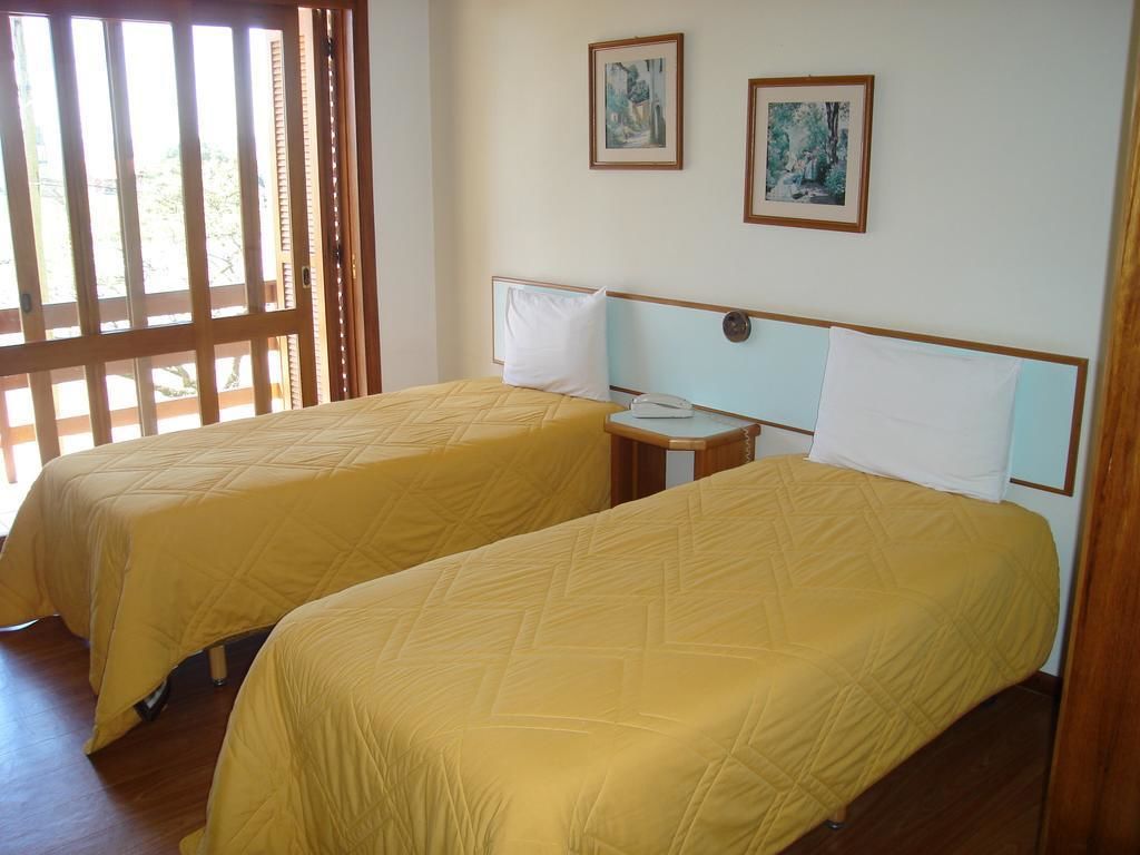 Habitación estándar con 1 cama matrimonial o 2 individuales | Escritorio, wifi gratis y ropa de cama 