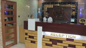 A reception desk with a sign that reads "RECEPTION". - Zimbo Golden Hotel (Dar es Salaam)