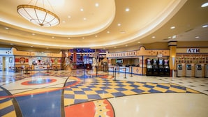 A casino interior with a checkered floor, a Player's Club, and ATM machines. - Tioga Downs Casino and Resort (Nichols)