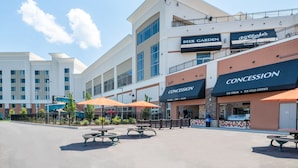 A multi-story building with a beer garden and a concession area offering ice cream and cold drinks. - Tioga Downs Casino and Resort (Nichols)