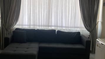 Family Room | Minibar, in-room safe, desk, iron/ironing board