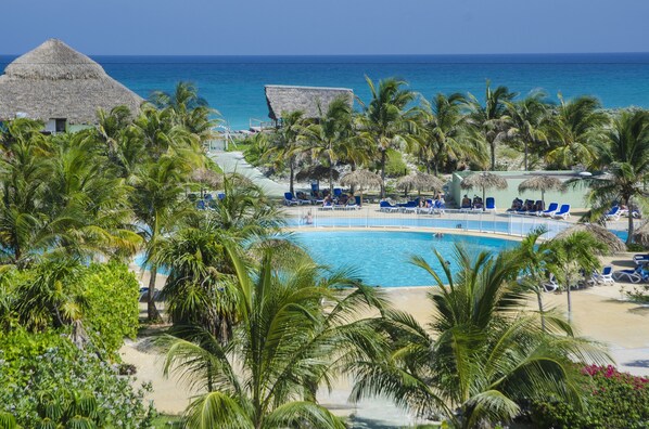 Outdoor pool, pool umbrellas, sun loungers