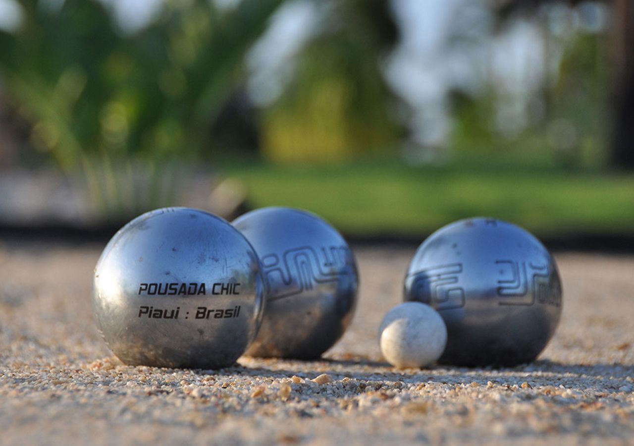 Three billiard balls on a textured surface.