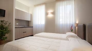 Studio | Luxe beddengoed, donsdekens, een kluis op de kamer