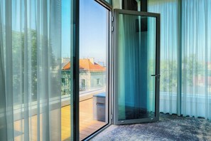 Enjoy a bright and airy room with a sliding glass door leading to a balcony.