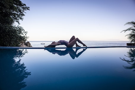 Outdoor pool, open 9:00 AM to 9:00 PM, pool umbrellas