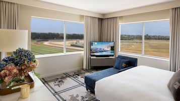Enjoy a view of the racetrack from the large window, with a comfortable bed and flat-screen TV for entertainment.