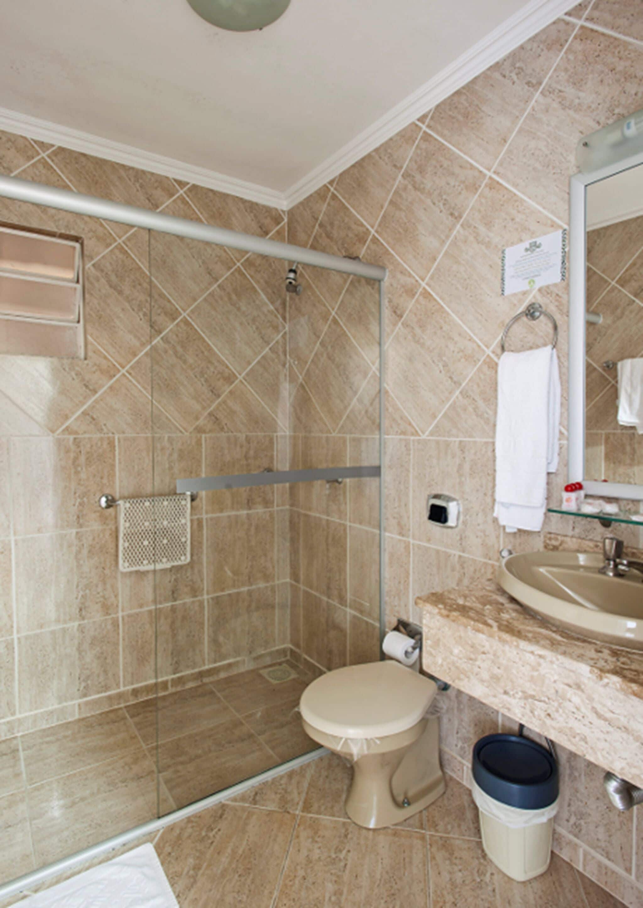 deluxe quadruple room | bathroom | shower, free toiletries, hair dryer, towels