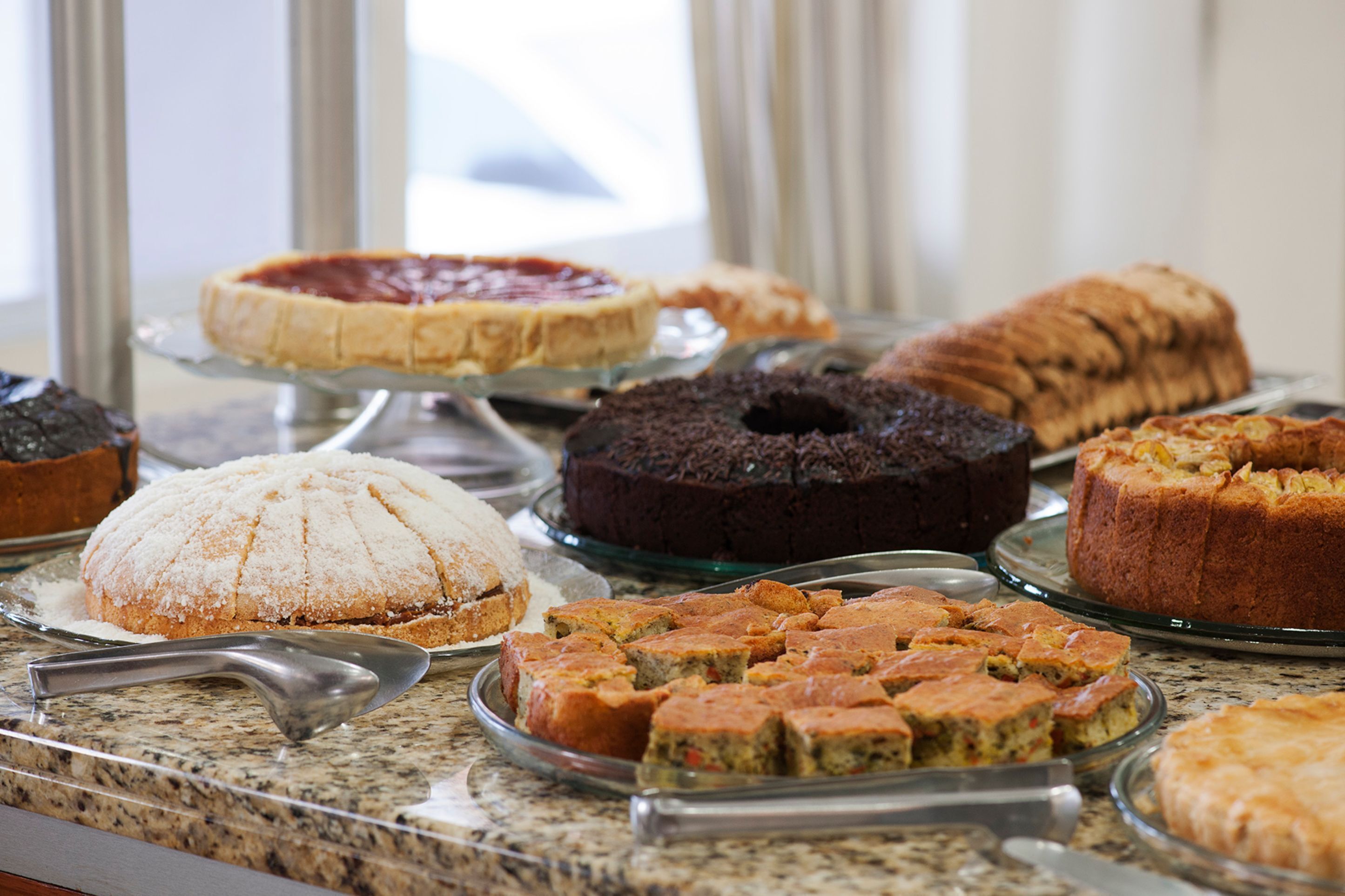 A variety of cakes and pastries on display.