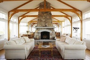 Open living w/stone fireplace. Seating for 14 dining& entertaining in main house