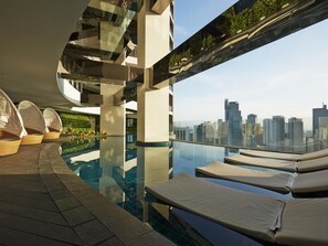 Indoor pool, open 6 AM to 11 PM, pool umbrellas, pool loungers
