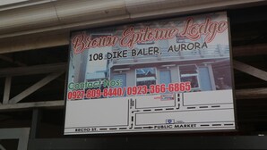 A sign for Brown Epitome Lodge, including the address and contact numbers. - Brown Epitome Lodge (Baler)
