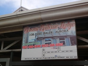 A sign for Brown Epitome Lodge, including the address and contact numbers. - Brown Epitome Lodge (Baler)
