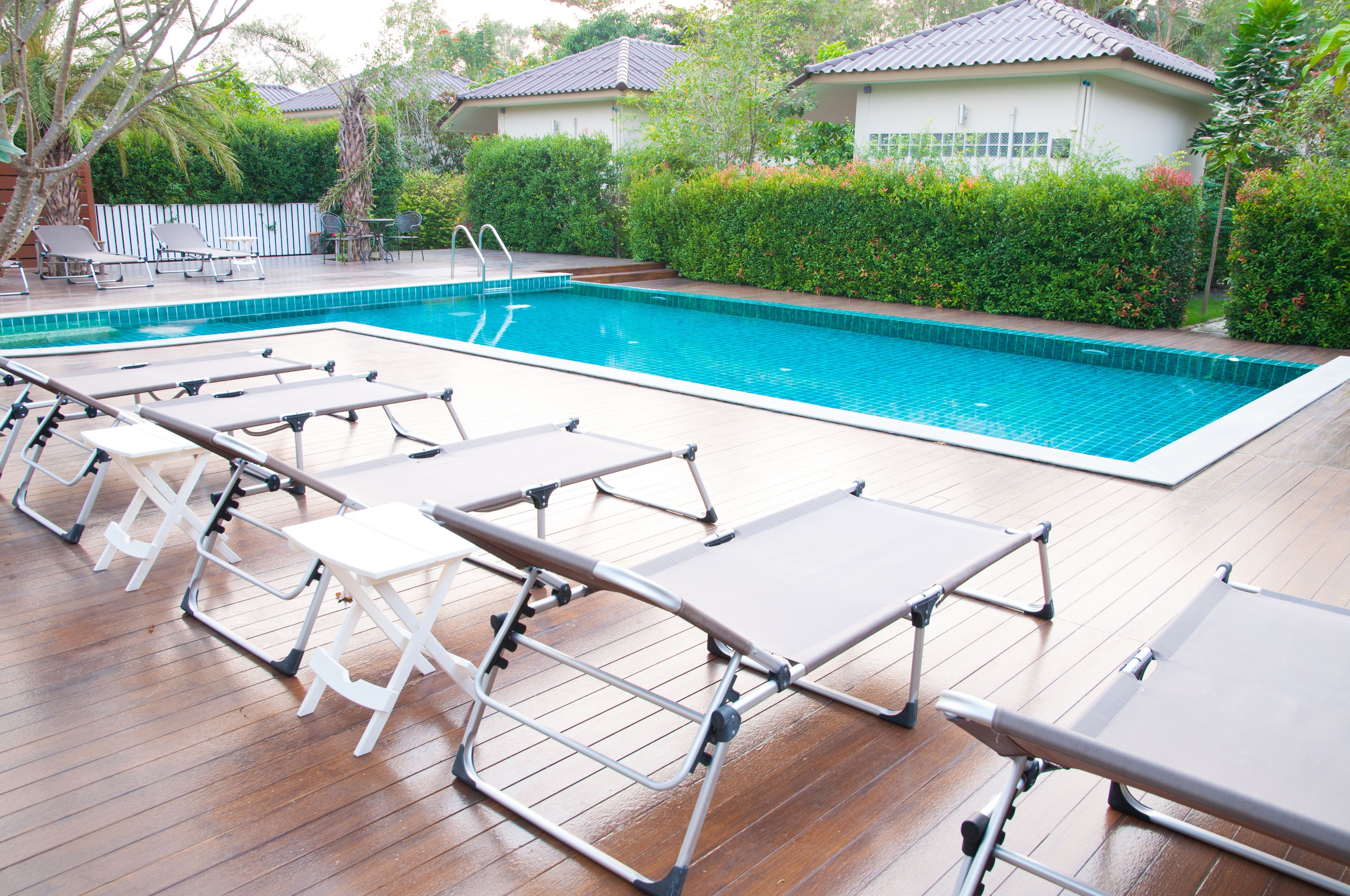 outdoor pool, open 7 am to 8:00 pm, pool umbrellas, pool loungers