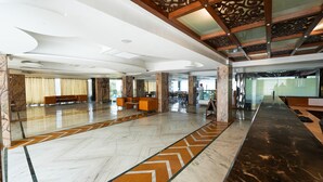 A spacious lobby with marble flooring, seating areas, and a reception desk. - Mystical Valley View Resort and Spa, Udaipur (Udaipur)