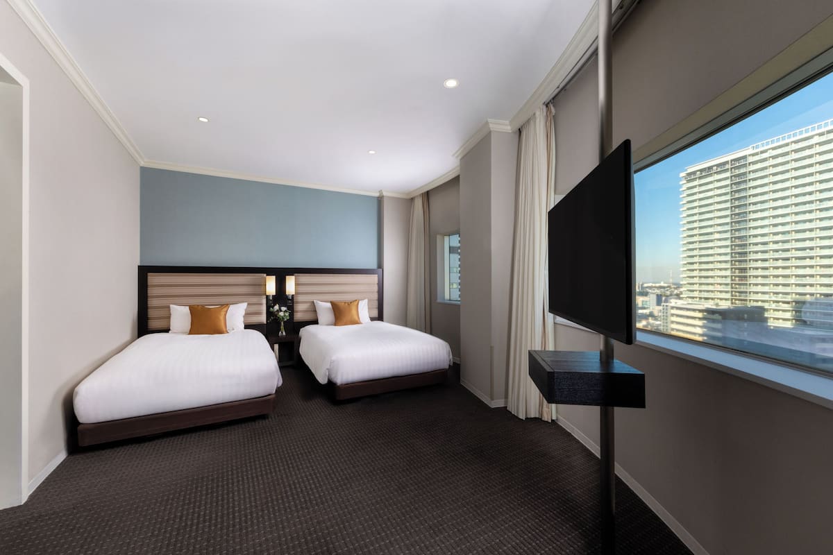 Suite, Non Smoking, City View | Down comforters, minibar, desk, laptop workspace