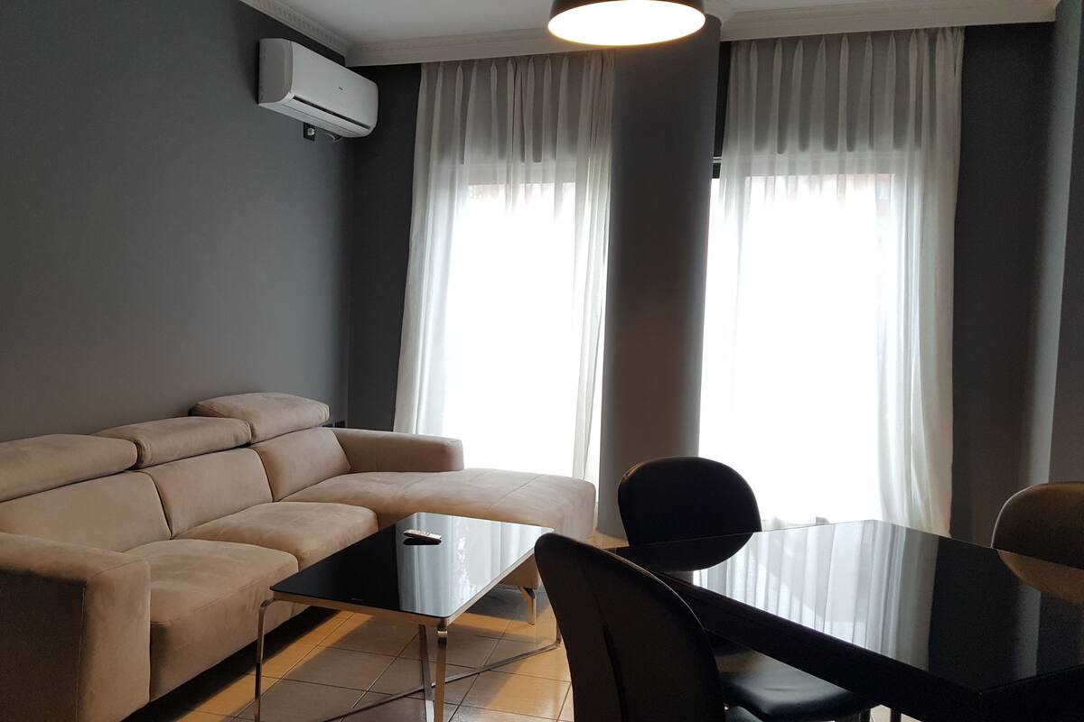 Family Apartment, 1 Bedroom, Kitchen, City View | Living room | Flat-screen TV, fireplace